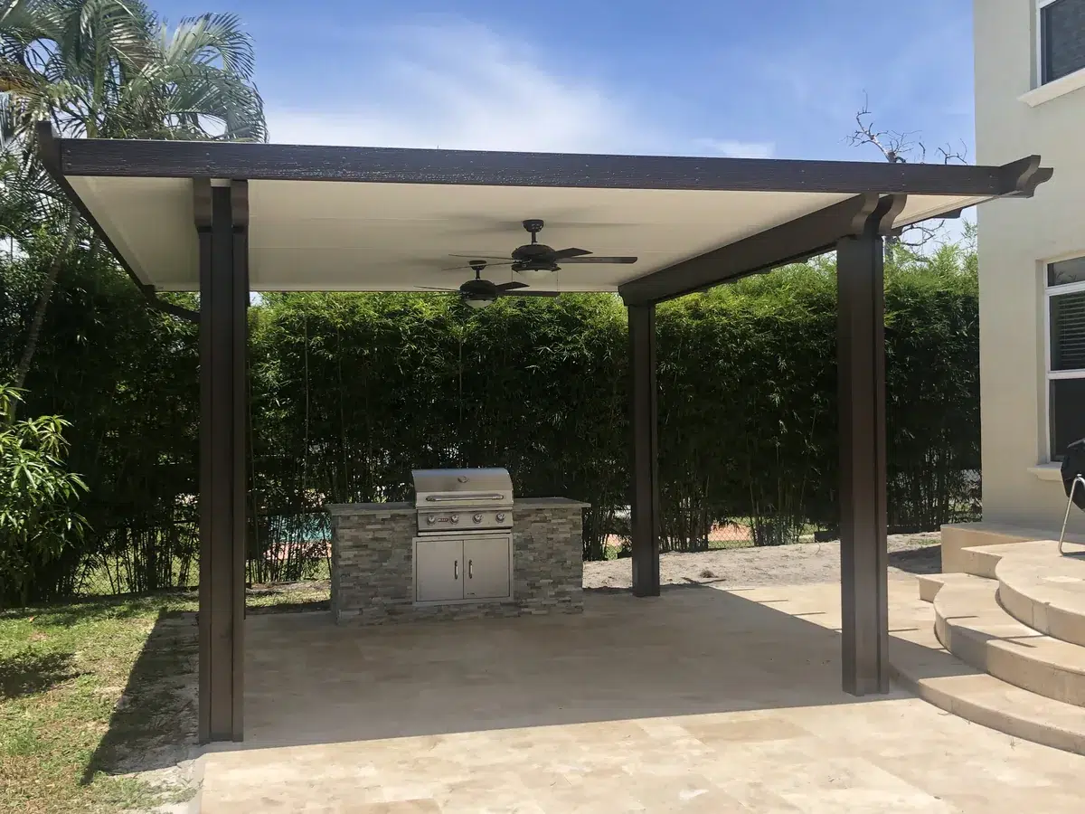 Outdoor living space with pool deck, lounge seating, and landscaping