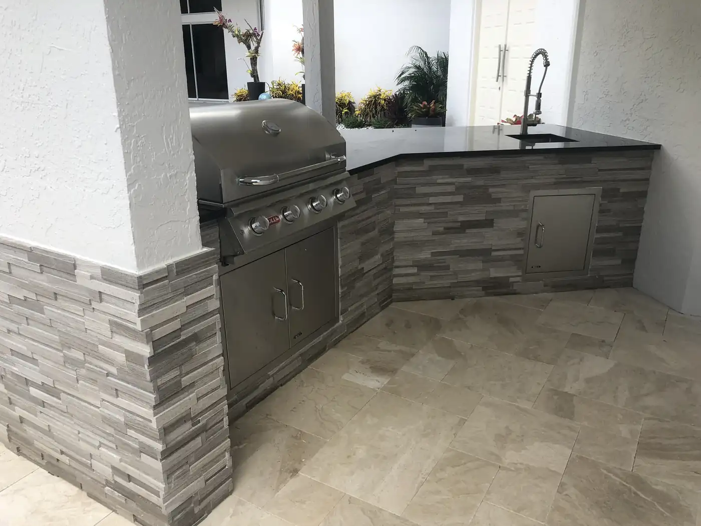 Poolside pergola and outdoor kitchen seating area